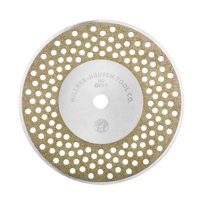 Millner-Haufen's Diamond Sharpening Wheel - Perforated - 4 1/2"on a white background. Wheel reads Millner-Haufen Tool Co. 80 Grit. The wheel is perforated with 80+ “sight holes” to promote the visibility of your surface during sharpening.